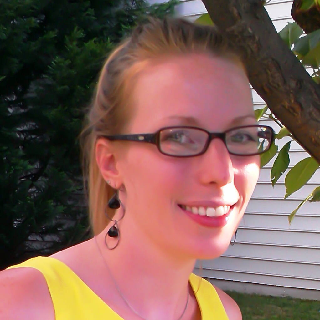 Sarah Torres, Environmental Scientist, stands outside in business casual attire in front of trees, with white siding visible in the background to the right.