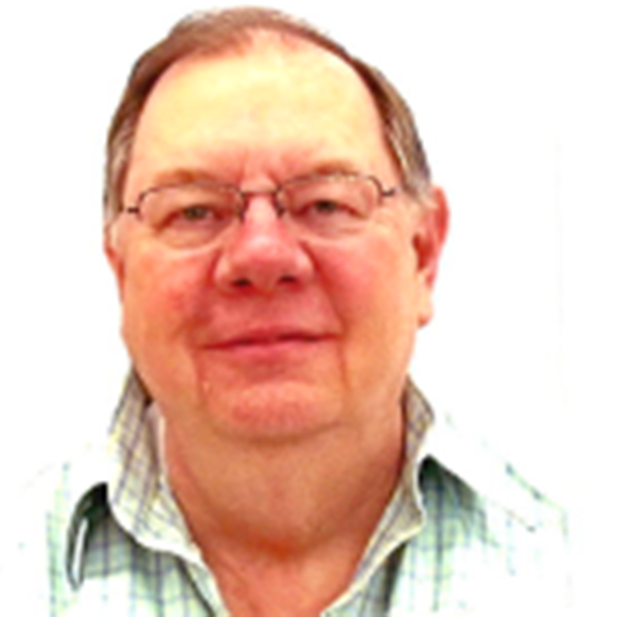 Tom Rowlett, Senior Civil Engineer, stands wearing business casual attire in front of a white background.